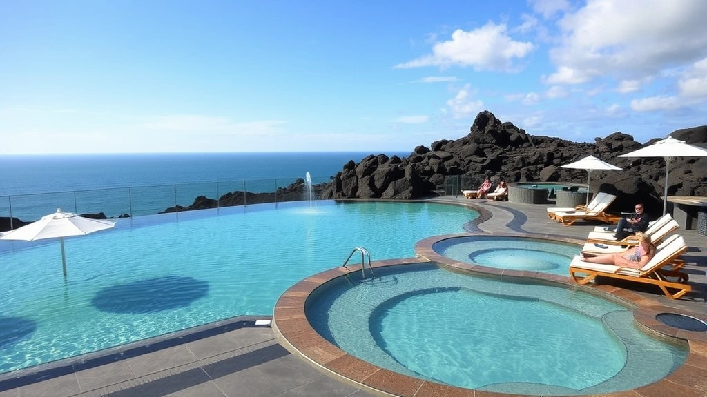 Luxurious outdoor thermal pool area with natural mineral water, comfortable lounge chairs, white umbrellas, ocean view, and guests relaxing by volcanic rock formations